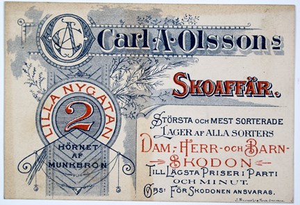Reklamkort tryckt i blått och rött med dekorationer och text.