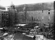 Stadshuset under uppförande. Borgargården under arbete. Vinterbild.