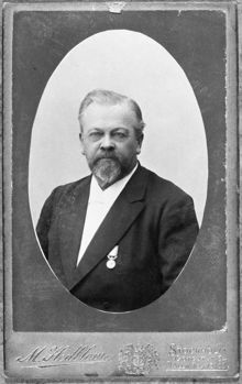 Porträtt på visitkort av folksskollärare Johan Olof Lindgren