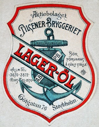 Öletikett tryckt i blått, rött och svart med bild av ett ankare samt text.